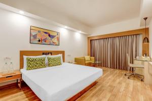 Katil atau katil-katil dalam bilik di Lemon Tree Hotel, Ahmedabad