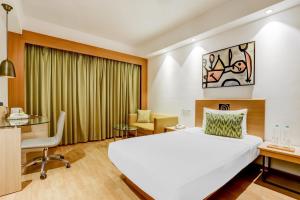Katil atau katil-katil dalam bilik di Lemon Tree Hotel, Ahmedabad