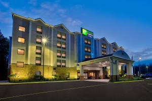 a hotel building with a gazebo in front of it at Holiday Inn Express Hotel & Suites Dover, an IHG Hotel in Dover