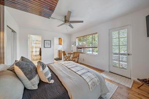 a bedroom with a bed and a ceiling fan at the Lucerne in Lake Worth