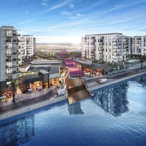 an aerial view of a city with a large body of water at ZAPBED House - Luxury Holiday Homes in Yas Island in Abu Dhabi