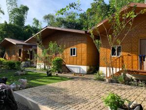 a house with a brick driveway in front of it at Izla Soanna in Panglao Island