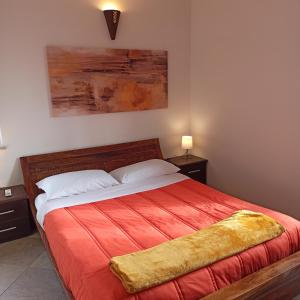A bed or beds in a room at Appartamento fiera di roma e aereoporto fiumicino