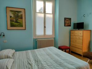 Postel nebo postele na pokoji v ubytování Villa Scalabrini