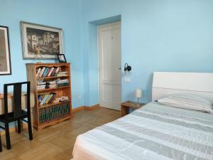 Postel nebo postele na pokoji v ubytování Villa Scalabrini