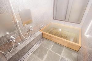 a bathroom with a shower and a tub with a sink at Alvilla Omi Maiko - Vacation STAY 14692v in Otsu