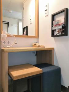 a bathroom with a vanity with a mirror at Silja Line ferry - Helsinki 2 nights return cruise to Stockholm in Helsinki