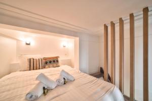 Posteľ alebo postele v izbe v ubytovaní Bel appartement au coeur de Montmartre