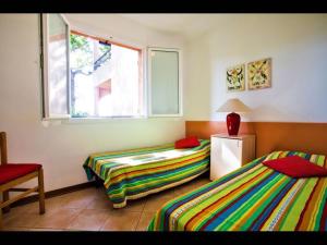 Voodi või voodid majutusasutuse Four rooms apartment Ghisonaccia - 150 m from the beach toas