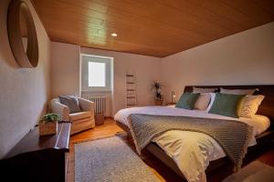 Osteria Manciana con Alloggio by Stay Generous tesisinde bir odada yatak veya yataklar