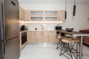 A kitchen or kitchenette at Central Luxury Apartment