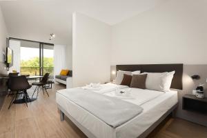 Residence Del Mar Emotion客房内的一张或多张床位
