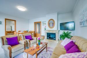 a living room with couches and a fireplace at Ideal Property Mallorca - Tobalu in Colonia Sant Jordi