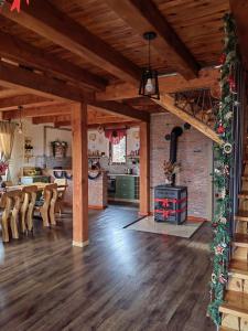 a living room with a wood stove in a room at Rustic dream MIA in Zlatibor