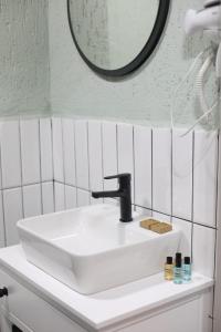 a white sink in a bathroom with a mirror at Mare House Boutique Hotel in Bursa