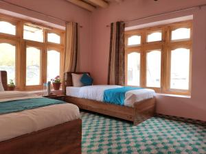 Postel nebo postele na pokoji v ubytování Wanla River Homestay
