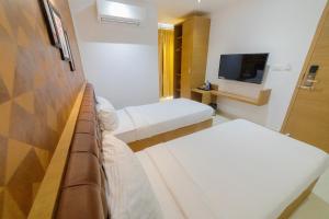Postel nebo postele na pokoji v ubytování Sri K residency