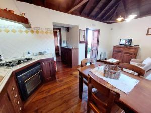 a kitchen with a table and a dining room at Panchita in Garafía