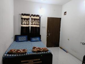Postel nebo postele na pokoji v ubytování Ekta Homestay