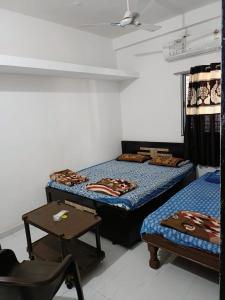 Postel nebo postele na pokoji v ubytování Ekta Homestay