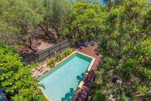 an overhead view of a swimming pool in a garden at Breathtaking Panoramic Ocean Views in Yaroomba