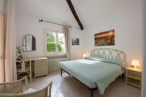 A bed or beds in a room at Villa Adelaide