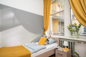 Posteľ alebo postele v izbe v ubytovaní Absynt Hostel Wrocław