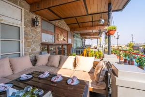 a patio with a couch and a table at Best Western Merrion in Amritsar