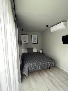 A bed or beds in a room at LA CASA CONTENEDOR