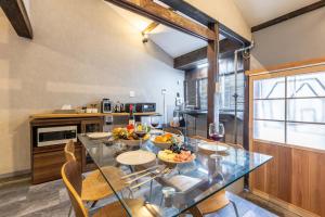 a kitchen with a glass table with fruit on it at rent tsuruhashi in Osaka +41 photos