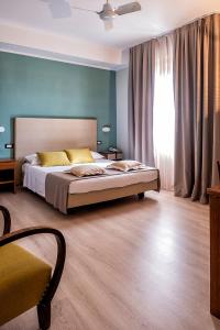 Postel nebo postele na pokoji v ubytování Albergo Cerchi