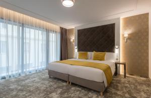 מיטה או מיטות בחדר ב-Leonardo Boutique Hotel Budapest M-Square