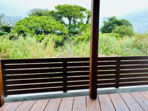 a view from a porch with a view of the ocean at AZ Hotel - Vacation STAY 56058v in Akaoki