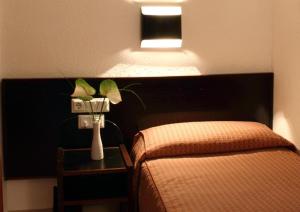 Letto o letti in una camera di Hotel Monegal