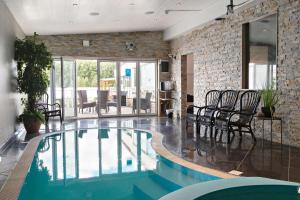 a living room with a swimming pool in a house at Best Western Hotell Hedåsen in Sandviken