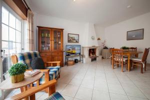 a living room with a couch and a table at Apartment T2 Alvor in Alvor
