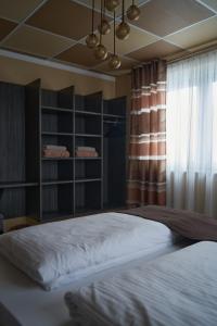 Ένα ή περισσότερα κρεβάτια σε δωμάτιο στο Hotel Auszeit im Euro Rastpark Guxhagen