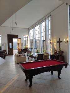 a living room with a pool table in it at Zen in Itaipava