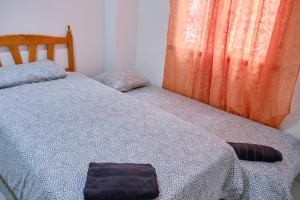 A bed or beds in a room at Apartamento en el centro de Portosin