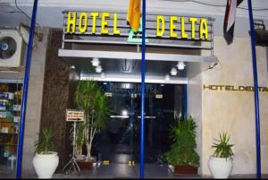 a hotel delia sign on the front of a building at Hotel Delta in Alexandria