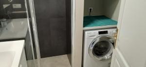 a small bathroom with a washing machine in it at CASA JABLILLO in Costa Teguise