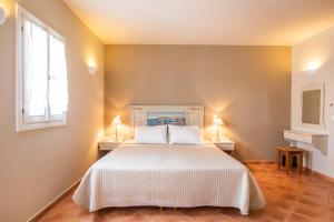 Aegean Village Beachfront Resort客房内的一张或多张床位