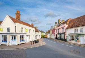 an empty street in a small town with buildings at Number One High Street Clare in Sudbury