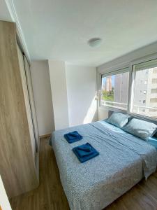 Postel nebo postele na pokoji v ubytování Apartamento Moderno Cerca de la Playa - Residencial AguaViva