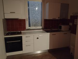 Kuchyň nebo kuchyňský kout v ubytování Merope Idrosuite + 6 fotografií