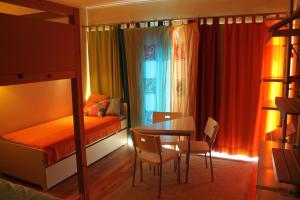 a bedroom with a table and a bed and a table and chairs at Top Quality Apartment in Lagos +44 photos