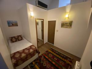 Postel nebo postele na pokoji v ubytování BEHRAMPAŞA OTEL &CAFE &RESTAURANT