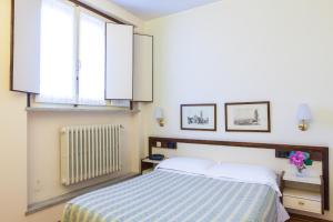 Posteľ alebo postele v izbe v ubytovaní Hotel San Marco