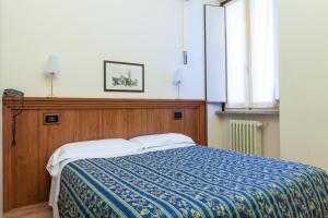 Posteľ alebo postele v izbe v ubytovaní Hotel San Marco