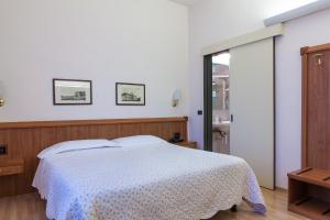 Posteľ alebo postele v izbe v ubytovaní Hotel San Marco